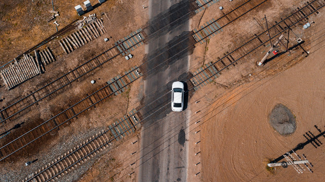 aerial view of a brand new car crossing railway