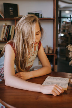 Young woman reading book