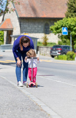 Scooter. Sunny Day. Ride. Daughter. Street. Mother