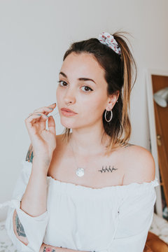 Portrait of woman with earrings and necklace