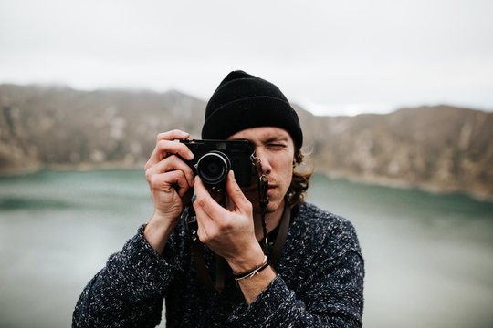 Man taking photo at beautiful lake