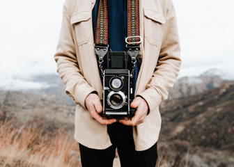 Person holding old camera