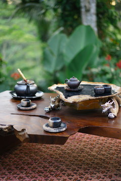 Beautiful tea set with ceramic cups on table