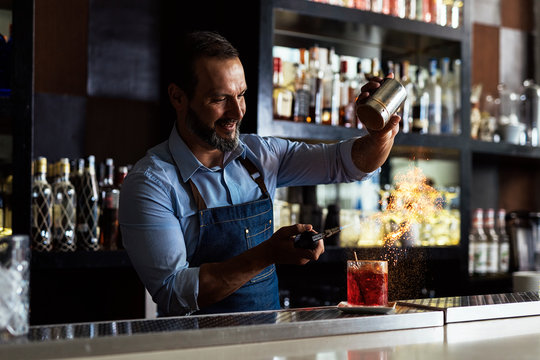 Professional young bartender working