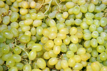 Bunch of green grapes on market. Grapes for food texture