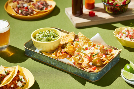 Tacos with pickled cucumbers and guacamole.