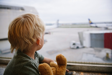 Boy watching airplane at the airport