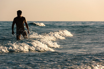 Naked man in the beach of Fuerteventura, Spain.