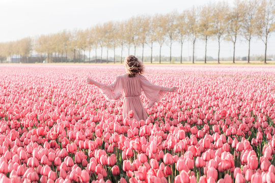 Young woman in a tulip field