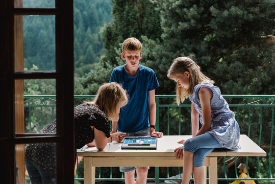 tweens playing a  board game