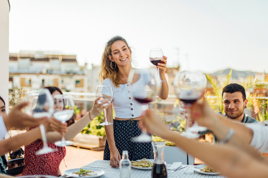 Hostess Raises a Wine Glass