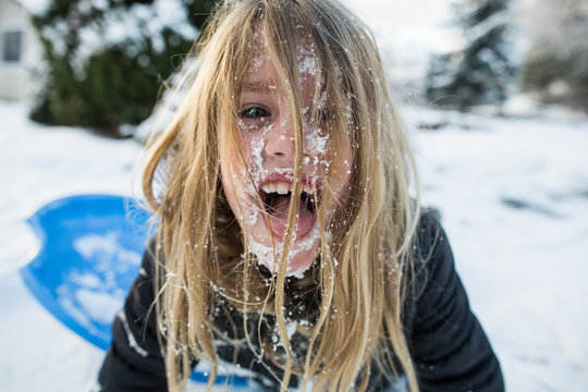 Snowy girl enjoying winter