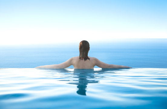 Woman in infinity pool