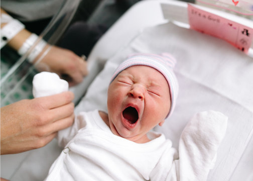 overhead view of yawning baby