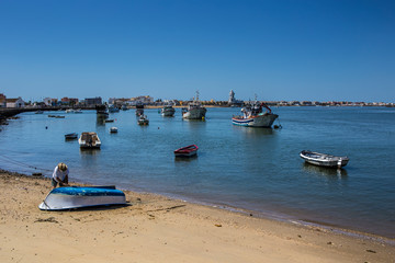 fishing boats on the beach old man fixing isla cristina huelva Cádiz