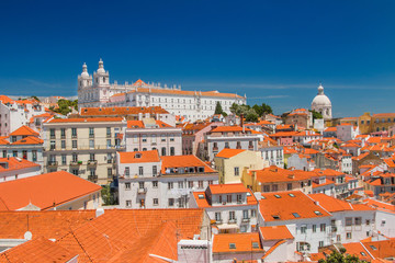 Fototapeta na wymiar Aerial view of central Lisbon, Portugal, beautiful city panorama, old houses and monastery Igreja Sao Vicente de Fora on the hill