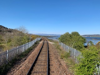 Fototapeta na wymiar empty train tracks heading into the horizon in scotland