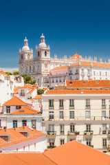 Aerial view of central Lisbon, Portugal, beautiful city panorama, old houses and monastery Igreja Sao Vicente de Fora on the hill