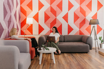 Young business woman working in a co-working environment