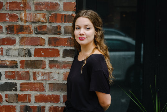 Young Girl By A Wall