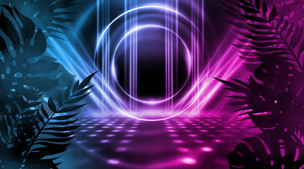 Background of empty dark scenes with neon lights and shapes, smoke. Silhouettes of tropical palm leaves in the foreground. Bright futuristic abstract background