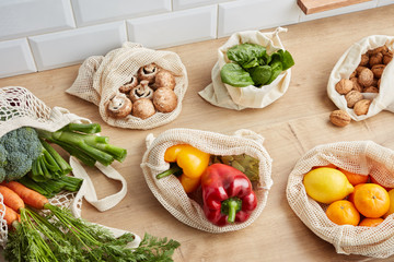 Fresh vegetables in reusable bags.