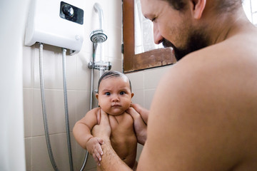 Father and Baby in Shower