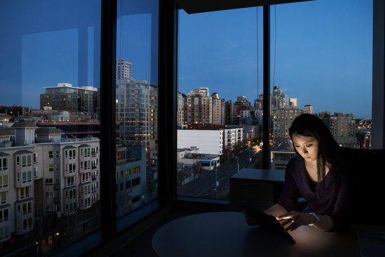 Female executive working at night