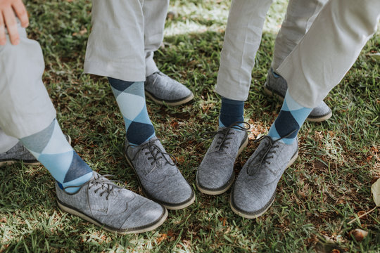 Groomsmen Showing off Shoes and Socks at Weddig