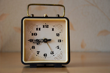 alarm clock on light background