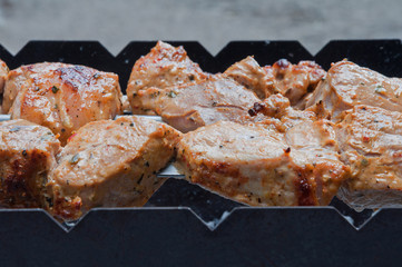 Fresh meat is baked on a barbecue
