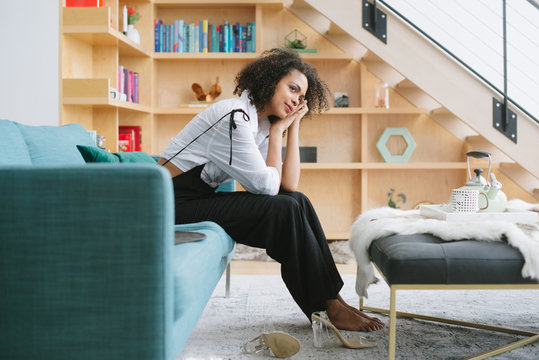 Young woman relaxing on couch at home