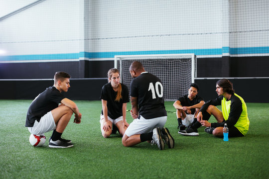 Soccer players taking a break.