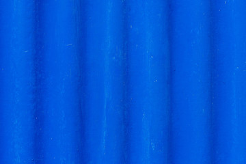 Naklejka na ściany i meble Wall covered with fiber cement painted blue. Colored background. Copy space