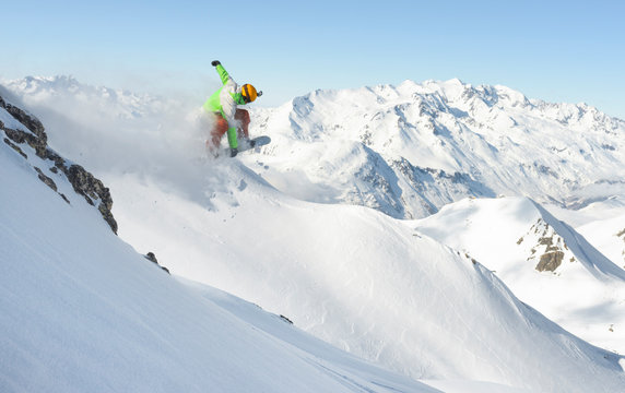 Male snowboarder jumping in the air