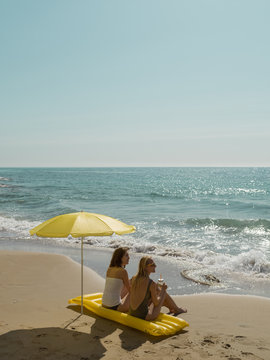 Girls relaxing on beautiful beach