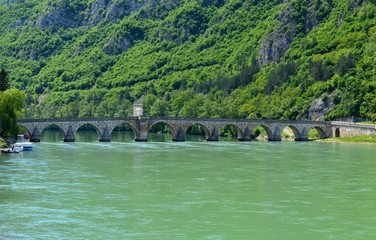 Fototapeta na wymiar old stone bridge on the river