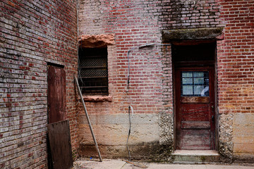 Fototapeta na wymiar Backdoor of an Abandoned Building