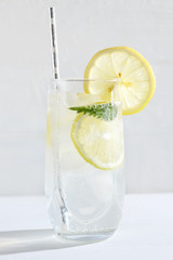 Refreshing and bracing drink in the heat. Lemonade with lemon and ice.
