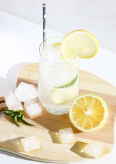 Cold drink, cocktail with ice and lemon. Selective focus.