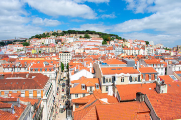 Fototapeta na wymiar Aerial view on buildings and orange roofs in Lisbon, Portugal. View from Above on city and architecture