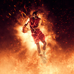 Man basketball player on flames background