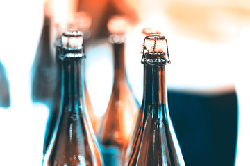 Glass champagne bottles with stoppers