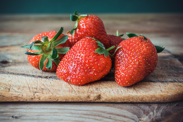 Strawberries on the brown wooden table