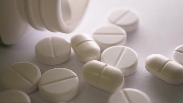 Close up of Healthy pills rotate on table