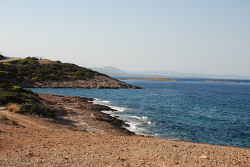 Fototapeta na wymiar Calm seas and sunny skies at the Hamolia beach near the city of Athens. Vravrona region, Attica, Greece.