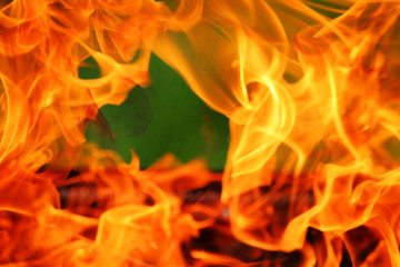 Close-up charcoal grill with orange powerful flame