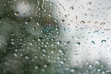 blur backgruond,Rain water on the car glass.