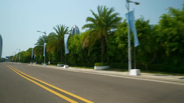 sanya city famous island resort sunny day car front window road trip pov panorama 4k hainan china