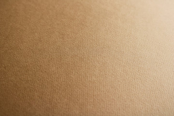 Close up of brown coloured uncoated fine art paper background texture